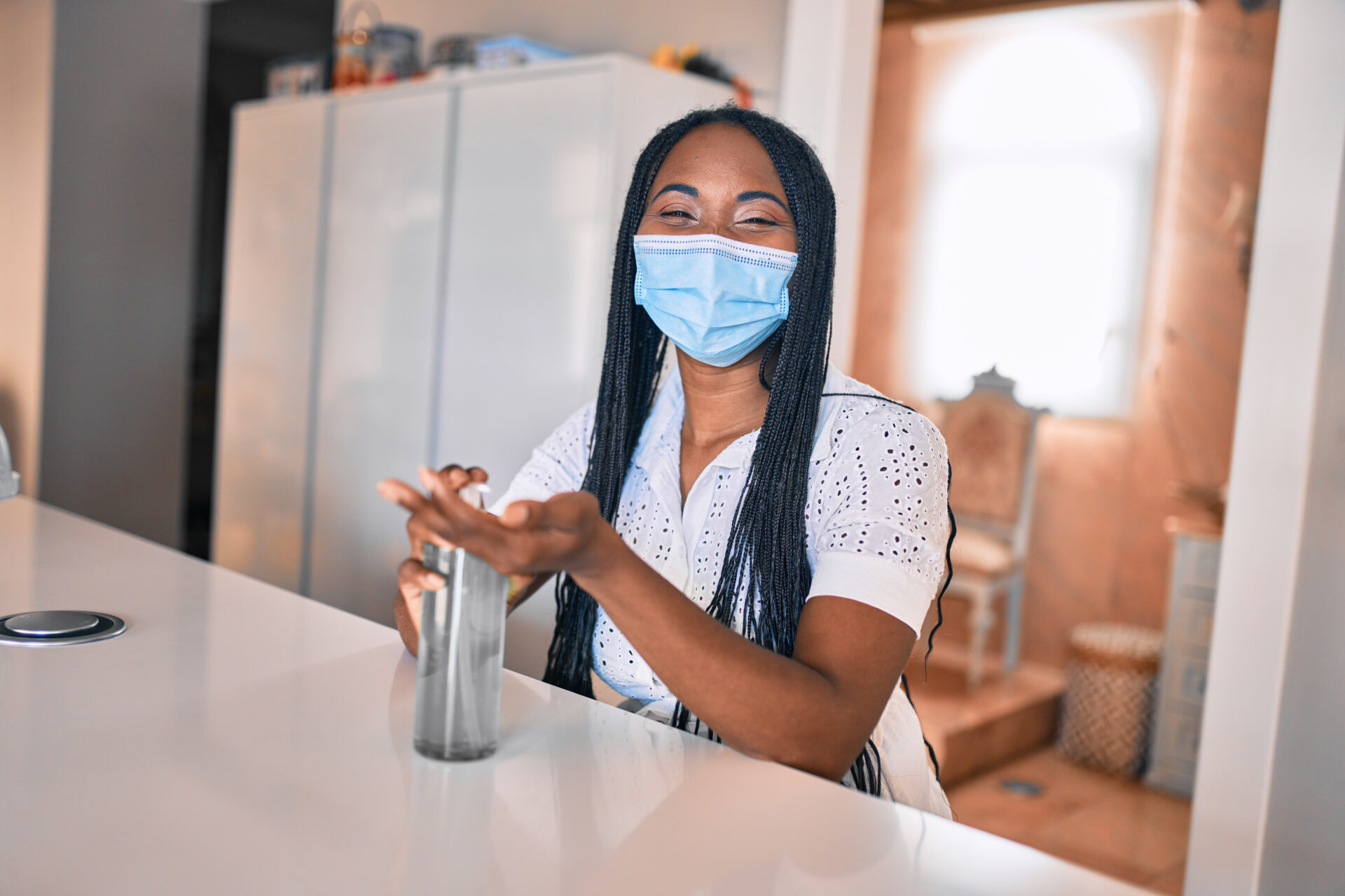 Young,African,American,Woman,Wearing,Medical,Mask,Using,Sanitizer,Hand