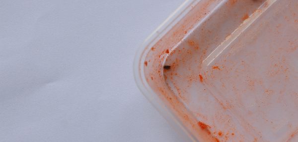 Stained plastic container