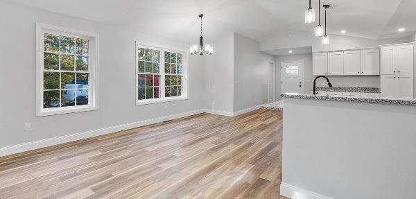 Clean and empty home with wooden floors and grey walls