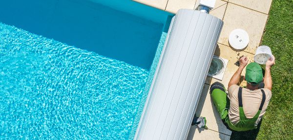 Professional Garden SPA Technician Cleaning Skimmer Filter From Dirt. 