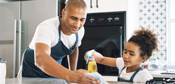 Father and daughter cleaning.