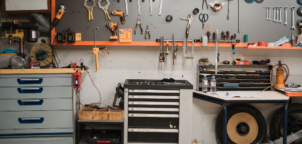 Workshop scene. Tools hanging on the wall in the workshop garage