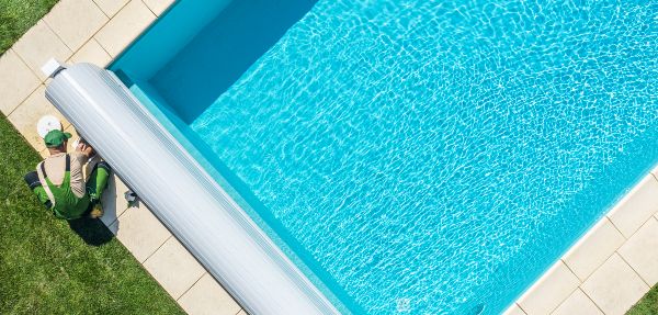 Residential Swimming Pool Technician Cleaning a pool.