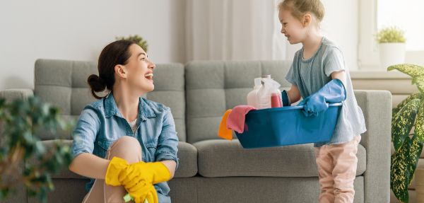 Mom and daughter bonding while cleaning.