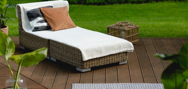 Lounger on wooden home deck.