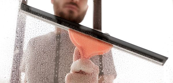 A man washing windows.