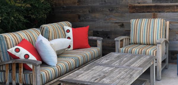 Wooden outdoor furniture couches and table.