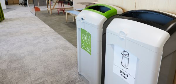 Recycling bins in an office space.