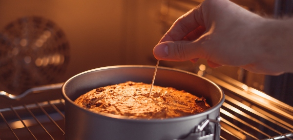 Check a cake for doneness by using the toothpick test.