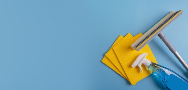 Window cleaning tools on a blue background