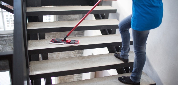 Person cleaning a staircase